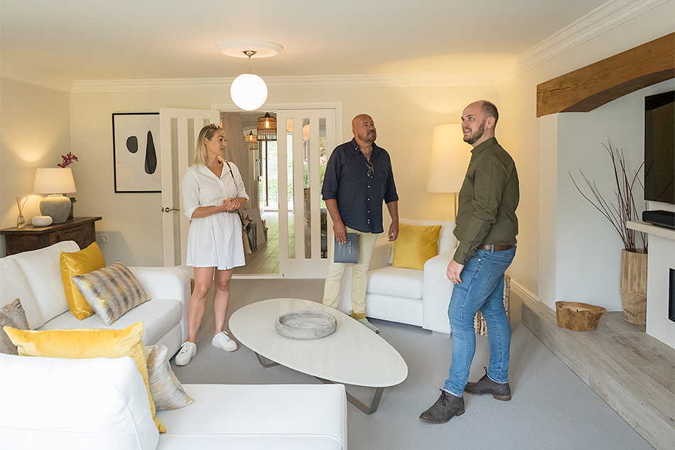 Aidan Flanagan of Storeys Of Cheshire showing potential tenant a property to let